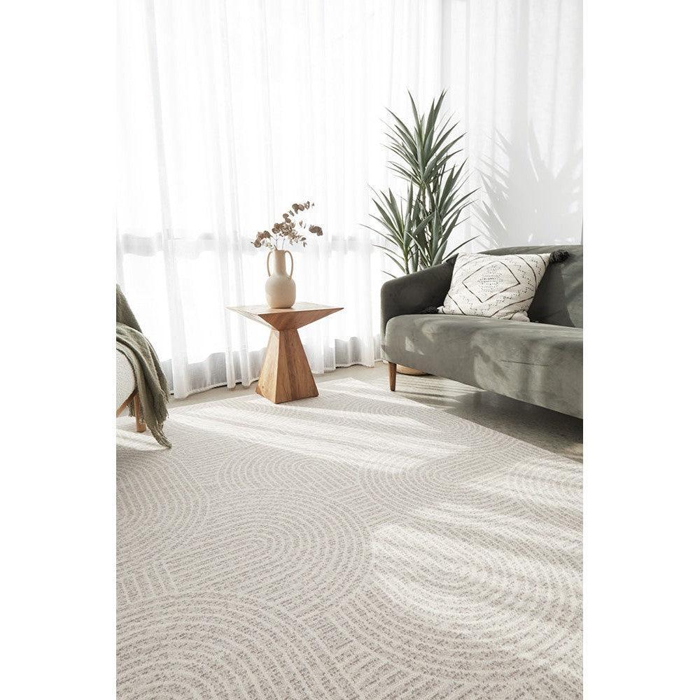 Prague Klarn Tan Rug featuring circular geometric pattern in tan, cream and beige on light cream background, hand-tufted wool