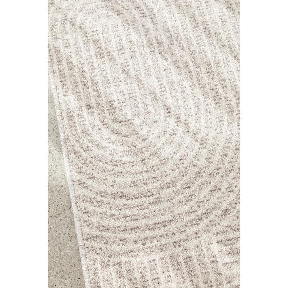 Prague Klarn Tan Rug featuring circular swirl pattern in beige, tan and cream on cream background, machine-made by Rug Culture.