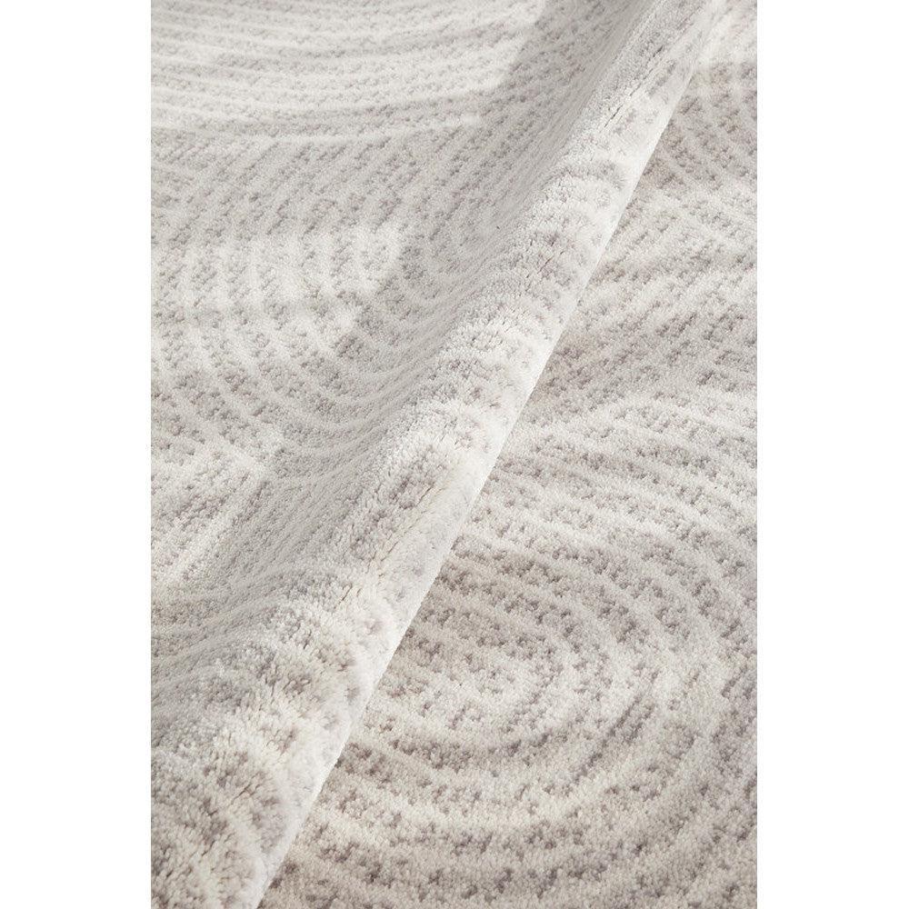 Prague Klarn Tan Rug featuring abstract wavy pattern in tan, cream and beige on ivory background, hand-tufted wool