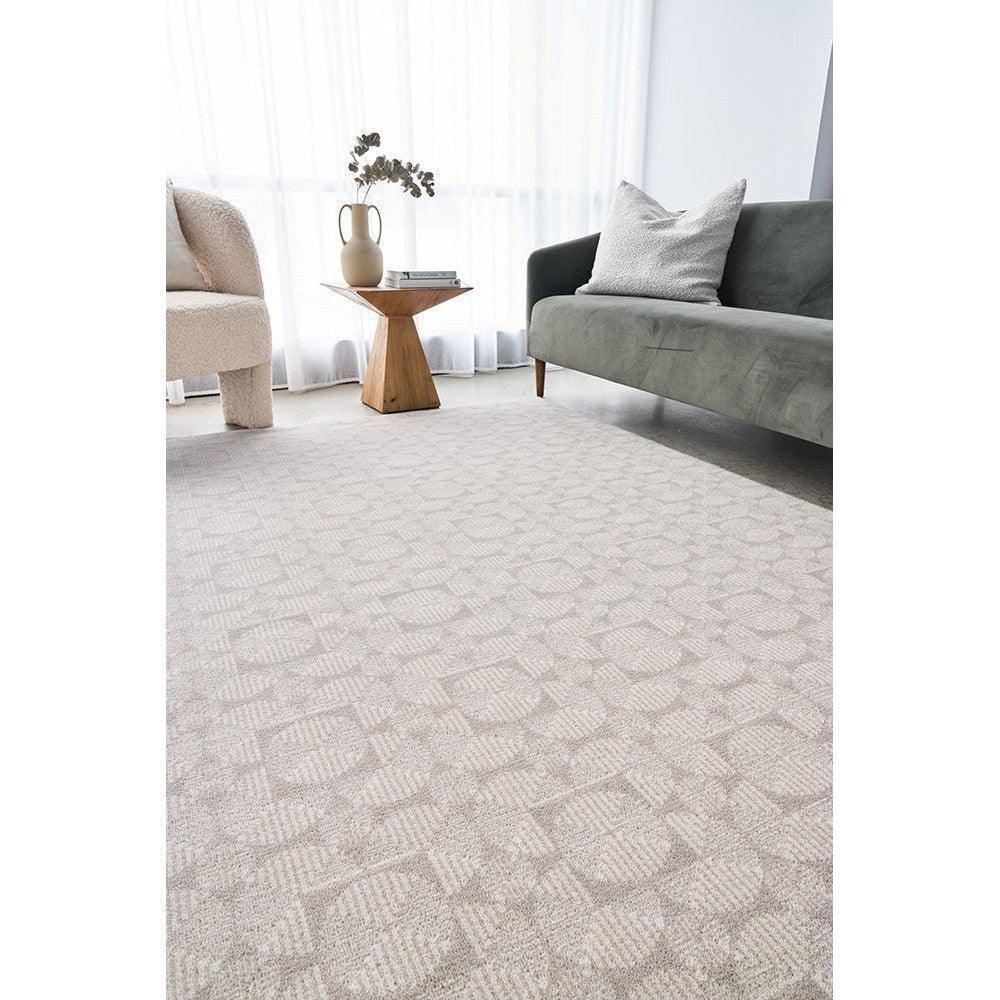 Prague Niko Silver Rug featuring geometric circular pattern in silver, cream and beige on ivory background, power-loomed wool