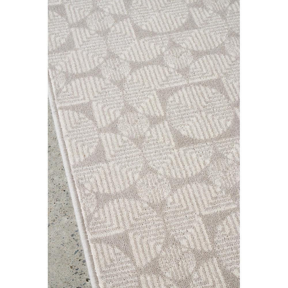 Prague Niko Silver Rug featuring geometric square pattern in silver and cream on light beige, machine-woven polyester