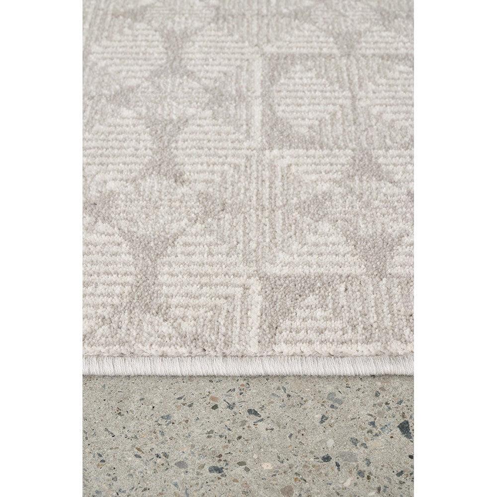 Prague Niko Silver Rug featuring geometric square pattern in silver, cream and taupe on pale beige background, machine-made polyester