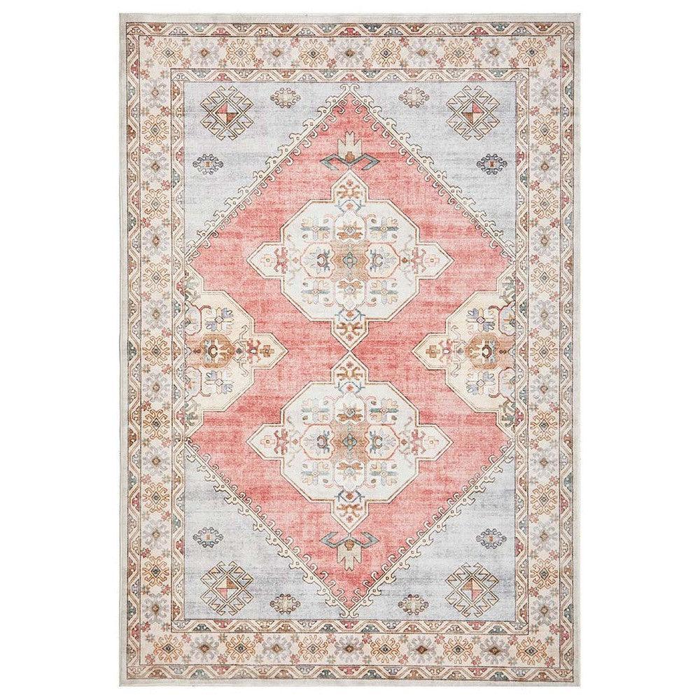 Revive Avril Rose Rug featuring ornate geometric medallion in coral pink, ivory, pale blue on light grey background, hand-tufted wool