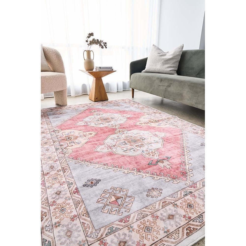 Revive Avril Rose Rug featuring geometric medallion pattern in pink, ivory and grey on pale grey background, machine-woven rug