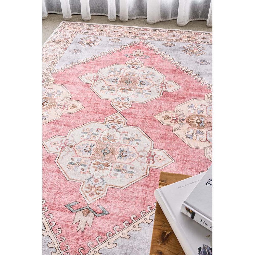 Revive Avril Rose Rug featuring geometric medallion pattern in pink blush, ivory, sage blue on light ivory background, hand-tufted wool