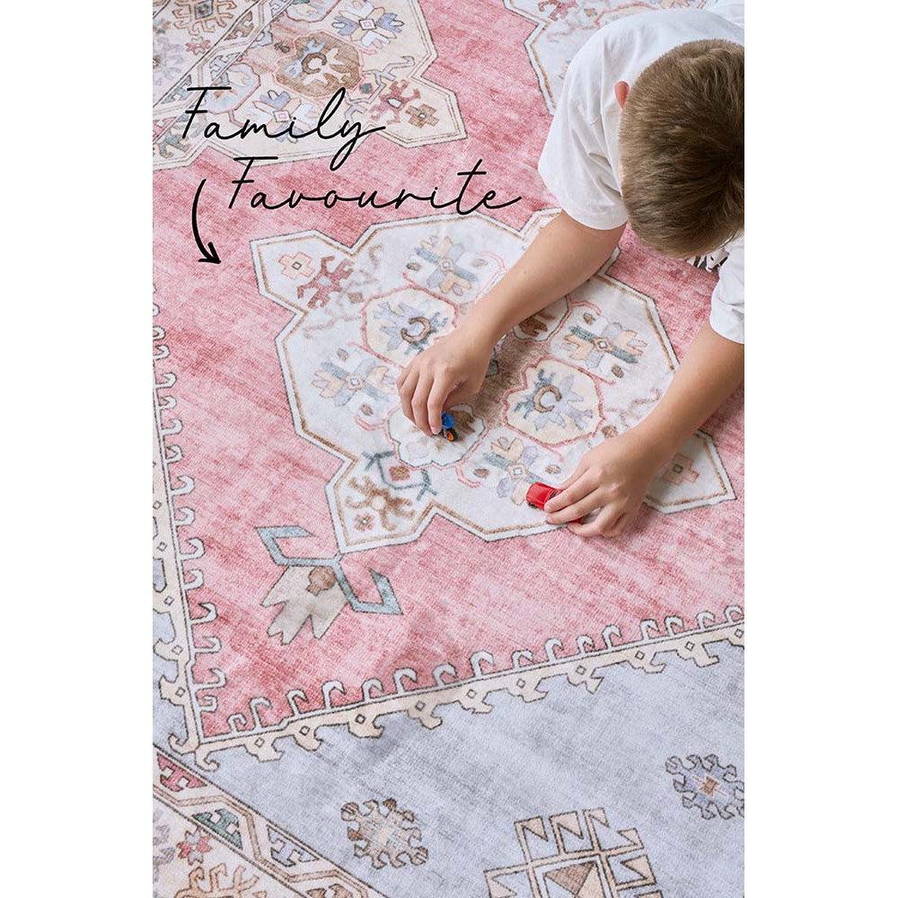 Revive Avril Rose Rug featuring vintage geometric medallion in pink, ivory, dusty blue, sage on pale grey background, hand-tufted wool