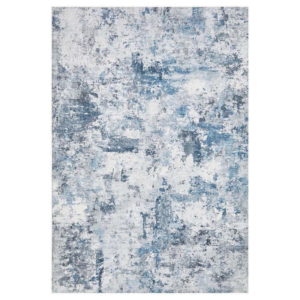 Revive Cato Blue Rug featuring abstract distressed pattern in powder blue, steel blue and ivory on white background, machine-made rug