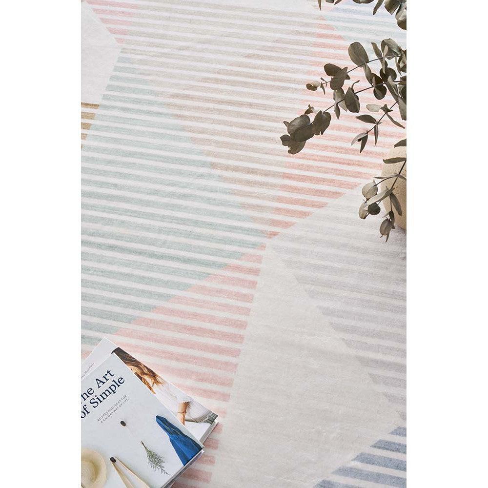 Revive Dali Pastel Rug featuring diagonal striped pastel pattern in pink, sky blue, mint and pale gray on ivory background, hand-tufted wool