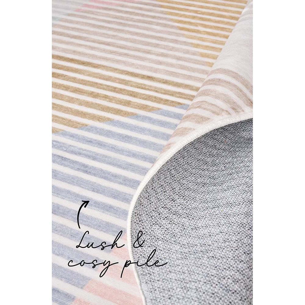 Revive Dali Pastel Rug featuring striped pattern in blush pink, powder blue, beige and cream on light beige background, machine-woven polyester