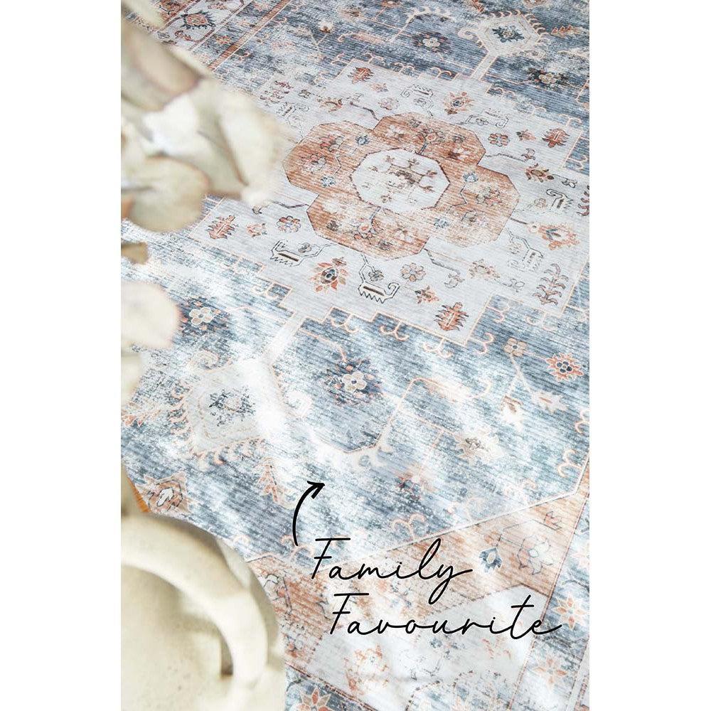 Revive Dawn Putty Rug featuring vintage distressed floral medallion in dusty blue, peach & cream on ivory, hand-tufted wool