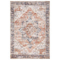 Revive Lila Rust Rug featuring distressed ornate medallion pattern in rust, navy and ivory on beige background, hand-tufted wool