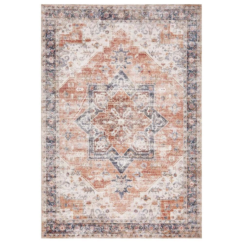 Revive Lila Rust Rug featuring distressed ornate medallion pattern in rust, navy and ivory on beige background, hand-tufted wool
