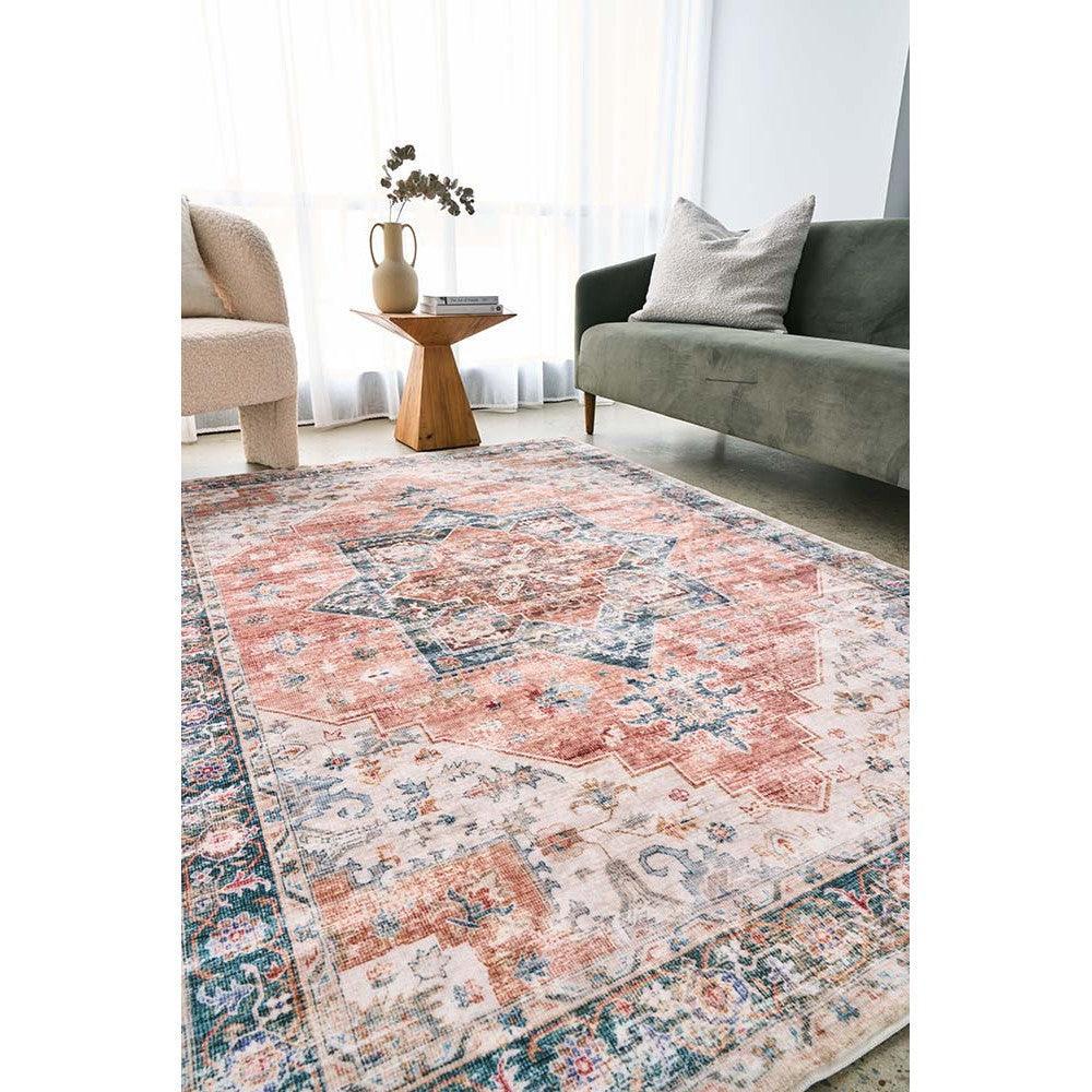 Revive Lila Rust Rug featuring vintage Persian geometric medallion in rust, peach, navy on ivory cream background, hand-tufted wool