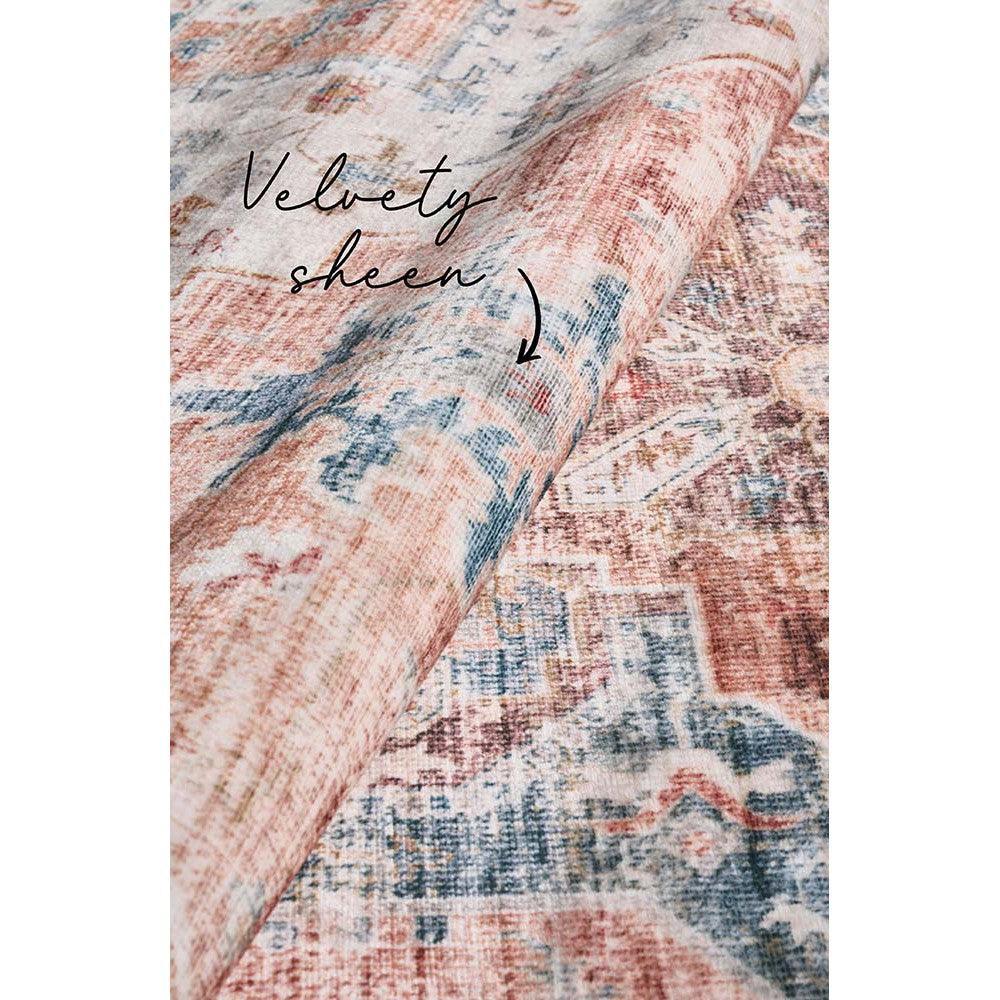 Revive Lila Rust Rug featuring distressed vintage floral pattern in rose, peach, rust, navy and cream on warm beige, hand-tufted wool