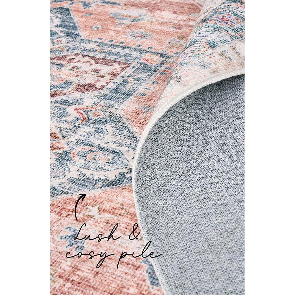 Revive Lila Rust Rug featuring vintage floral patchwork in coral, dusty blue, cream on ivory background, hand-tufted wool