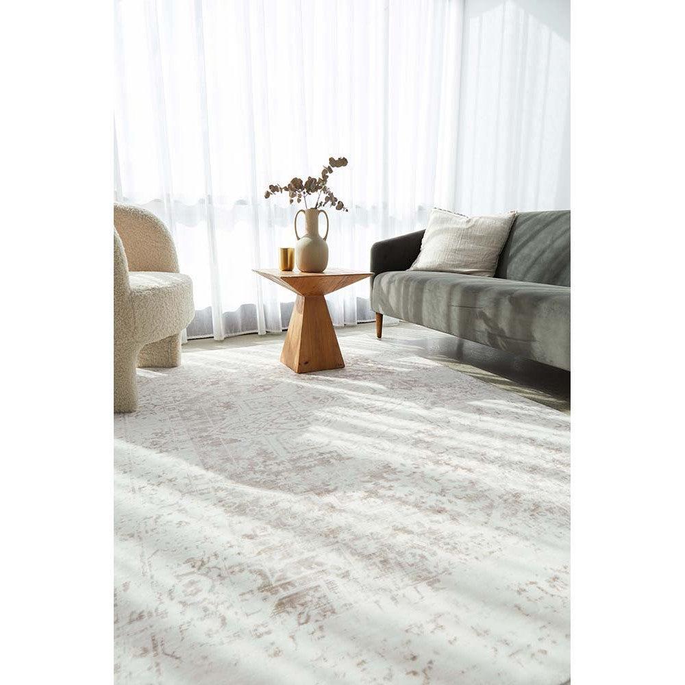 Revive Loni Natural Rug featuring distressed abstract pattern in ivory, cream, blush and taupe on soft cream background, hand-tufted wool