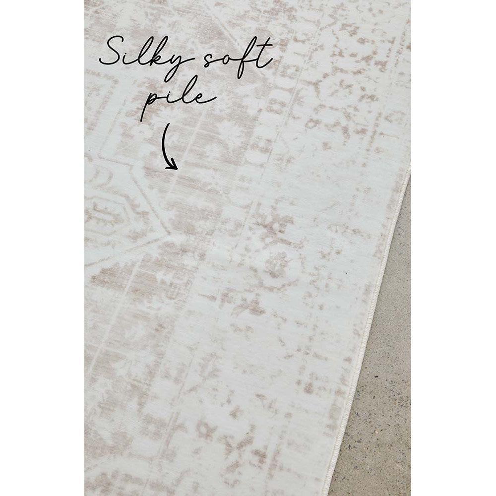 Revive Loni Natural Rug featuring distressed vintage pattern in ivory, cream, taupe on cream background, hand-tufted wool
