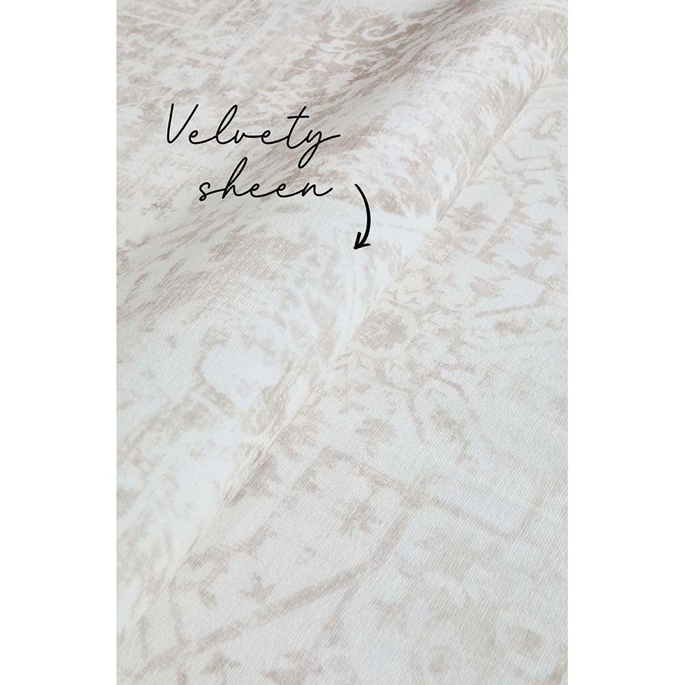 Revive Loni Natural Rug featuring distressed floral pattern in ivory, cream and beige on natural beige, machine-made polyester