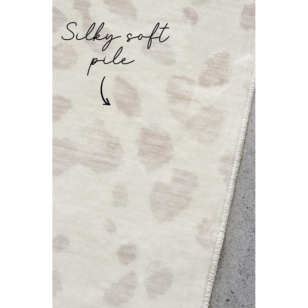 Revive Mila Natural Rug featuring subtle spotted pattern in cream, ivory, blush pink and taupe on ivory background, hand-tufted wool