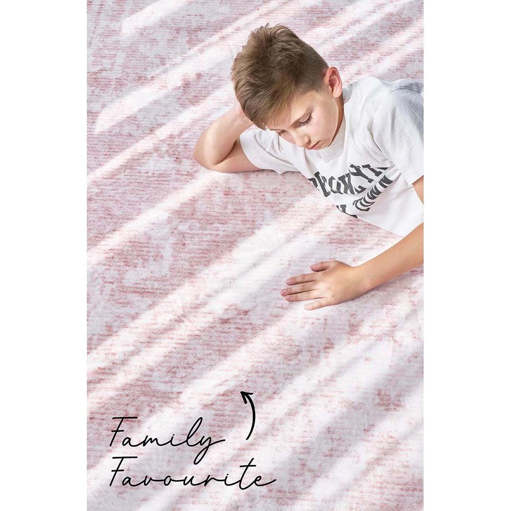 Revive Muse Blush Rug featuring soft abstract stripe pattern in blush pink, ivory and white on light pink background, hand-tufted wool