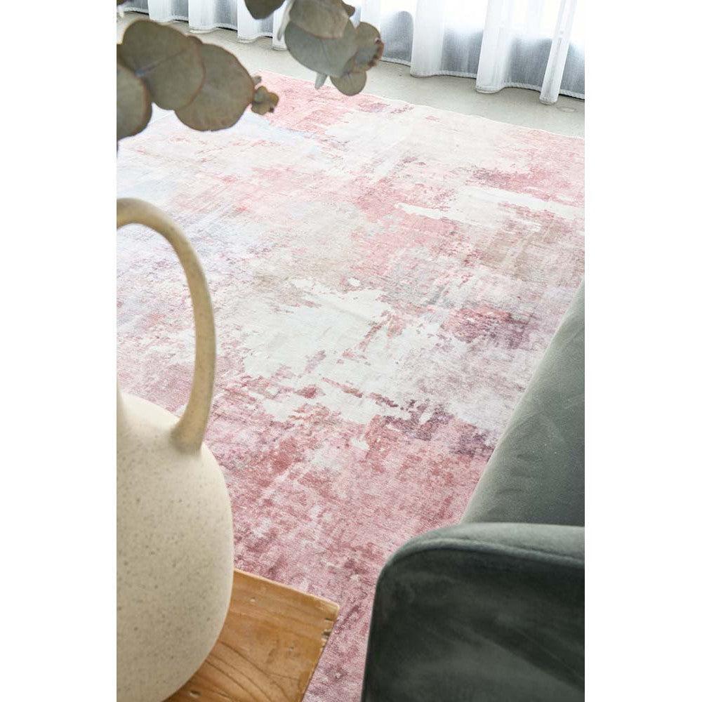 Revive Roxy Pastel Rug featuring abstract distressed pattern in blush pink, cream on pale pink background, hand-tufted wool