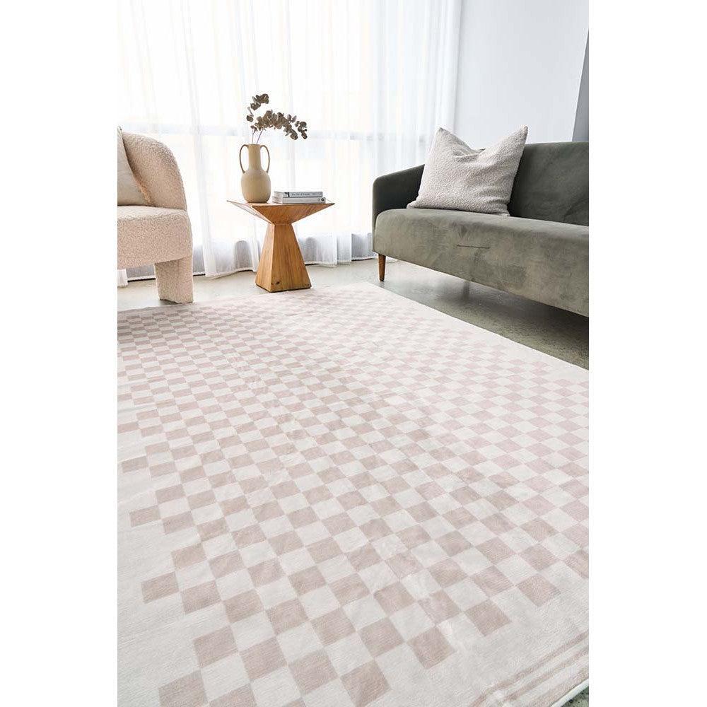 Revive Toshi Natural Rug featuring blush pink and cream checkerboard on pale beige background, machine-made wool blend