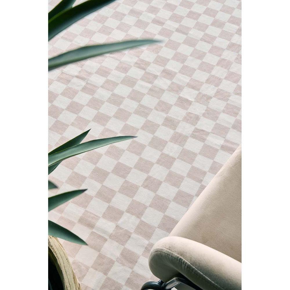 Revive Toshi Natural Rug featuring a pink and ivory checkerboard pattern on cream background