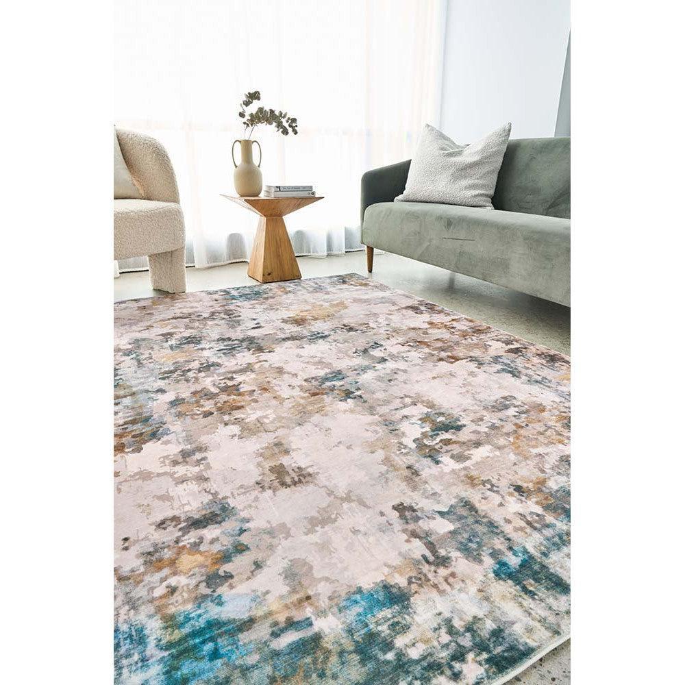 Revive Zane Marine Rug featuring abstract painterly pattern in navy, teal, sand and cream on light beige background, Rug Culture