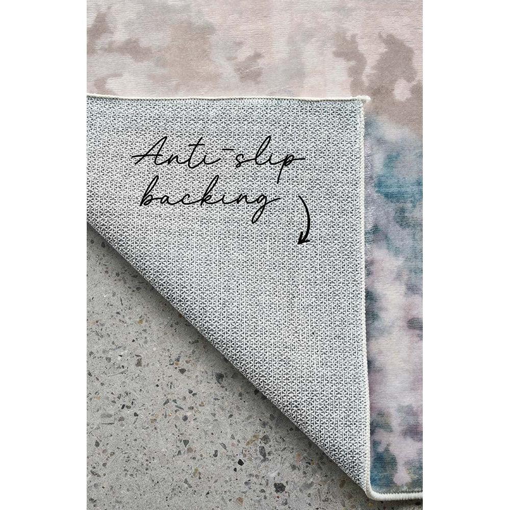 Revive Zane Marine Rug featuring subtle geometric pattern in light grey, charcoal and cream on pale backdrop, machine-made wool blend